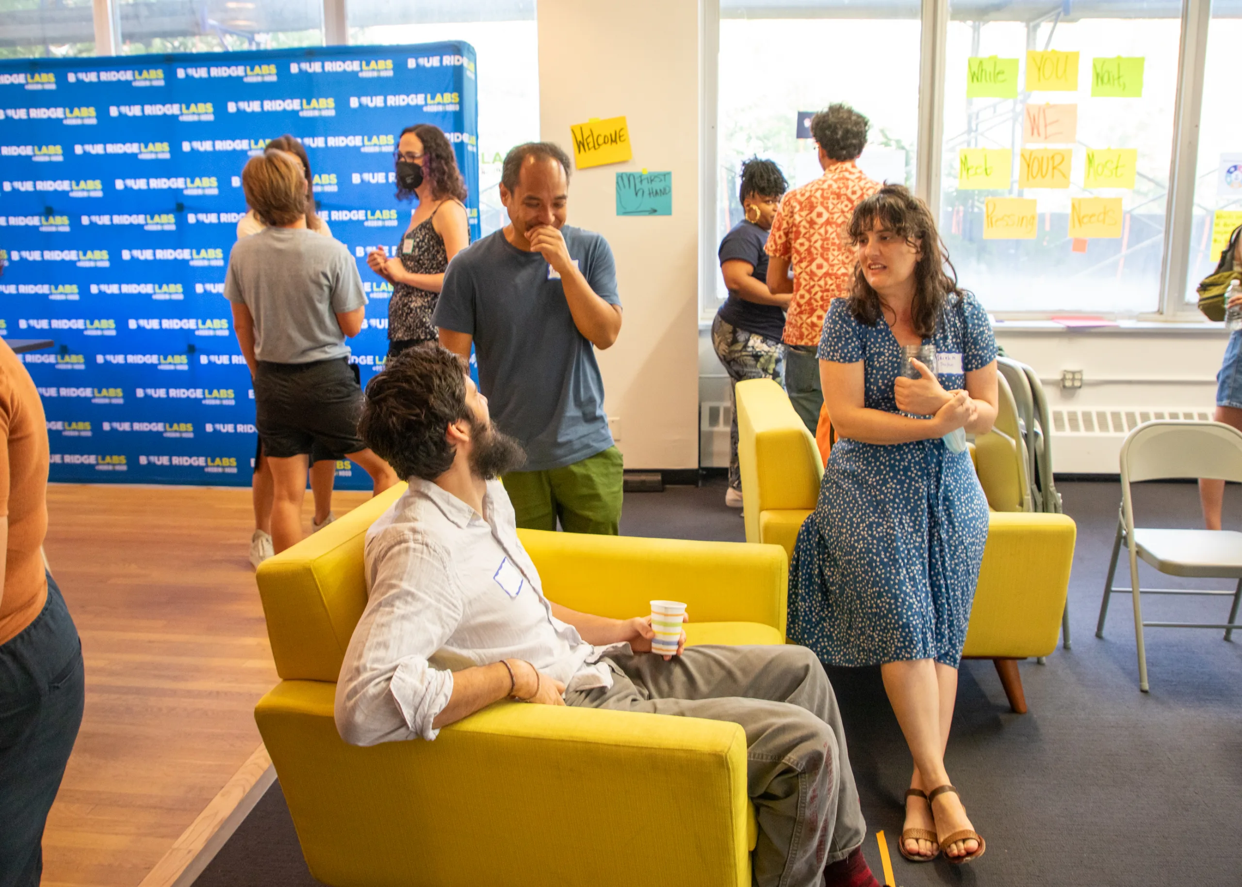 A gathering on 7 people networking in an office setting.