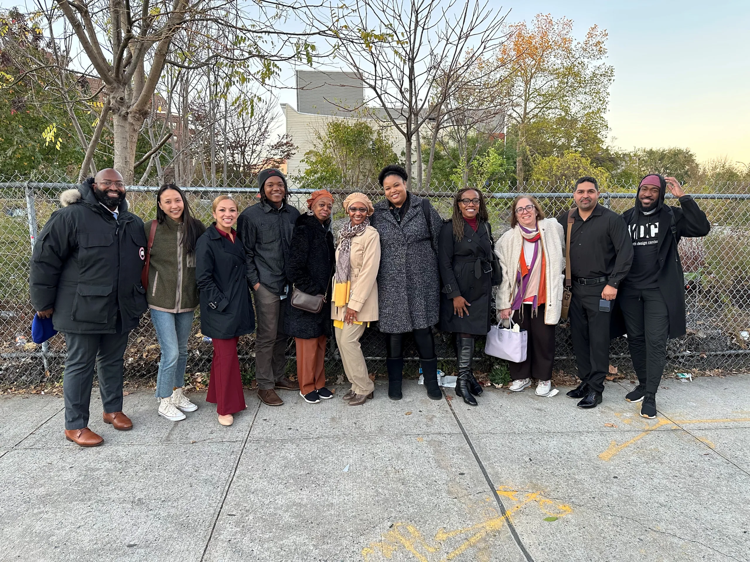 A large group of people posing for a photo in an outdoor setting.