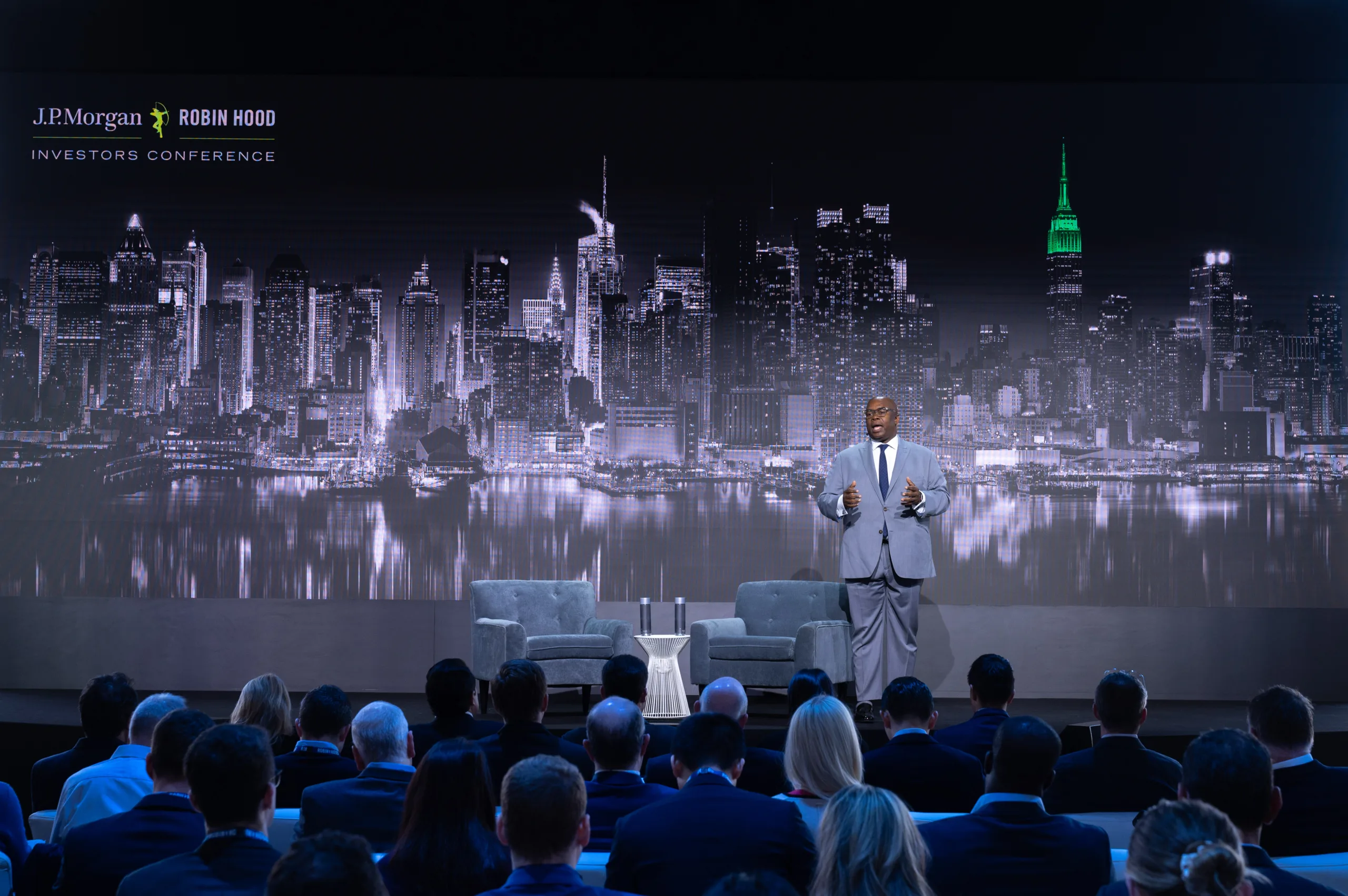 Robin Hood CEO Rich Buery speaking on a stage at an event.